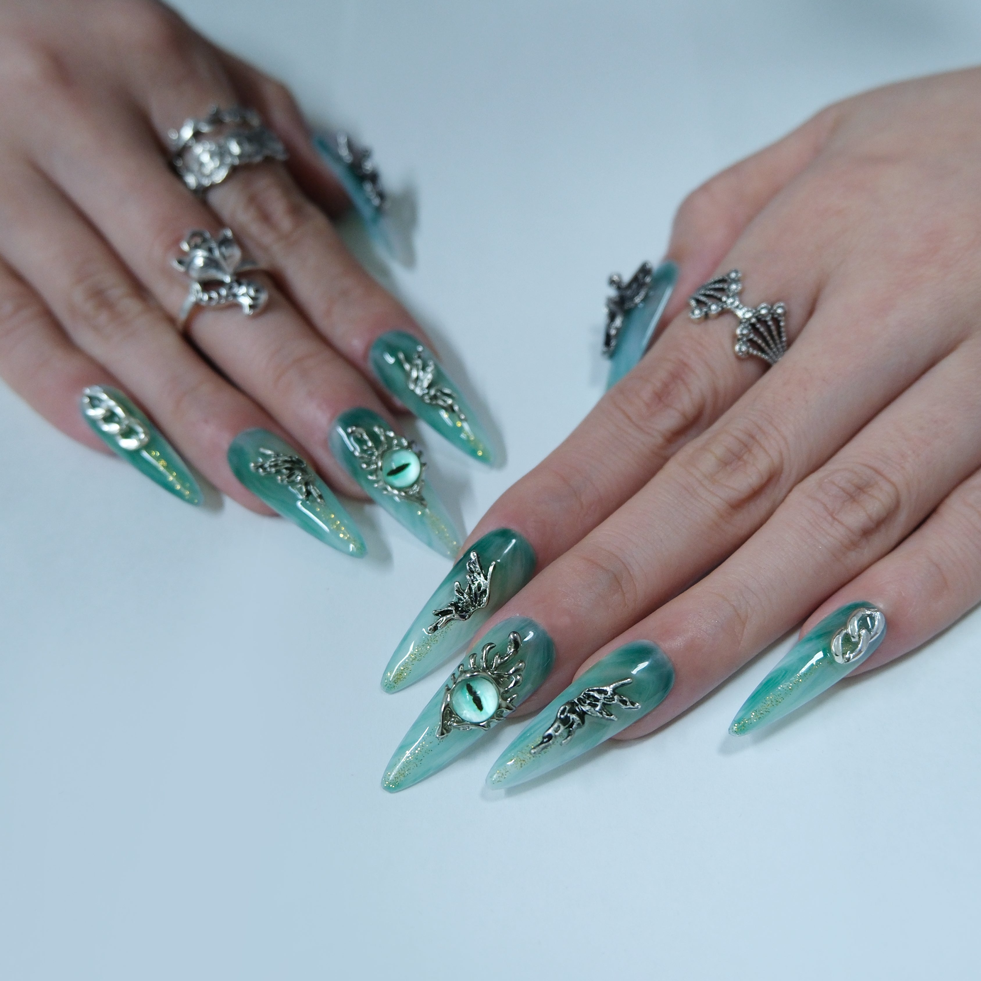 Teal Dragon Eye Nails