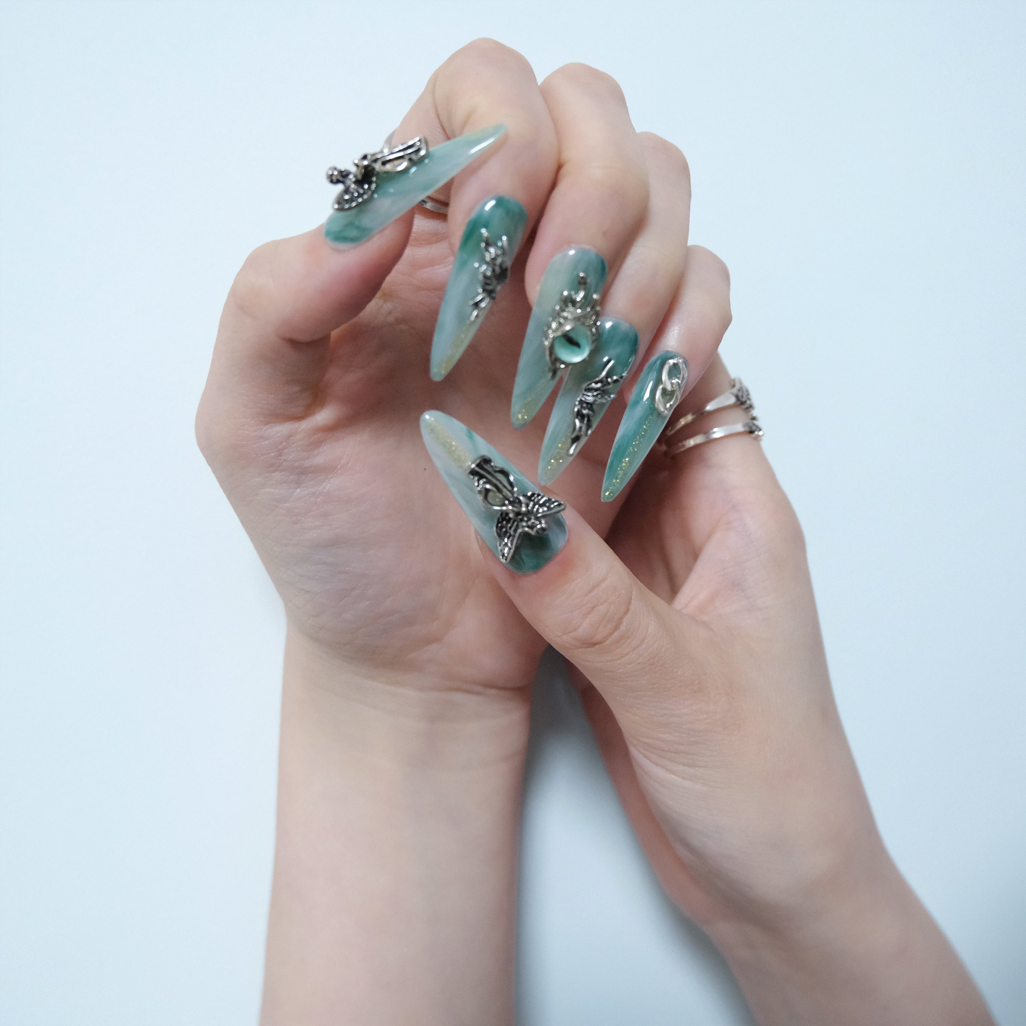 Teal Dragon Eye Nails