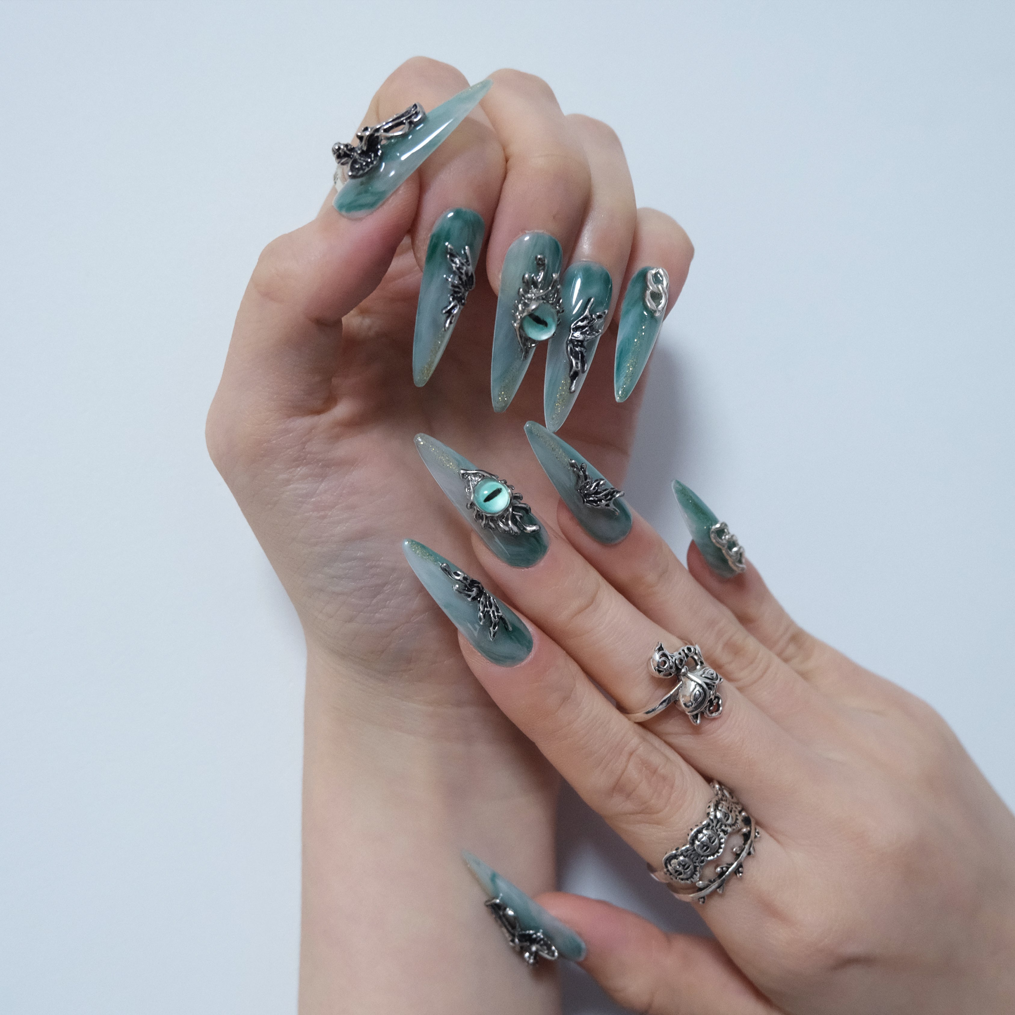 Teal Dragon Eye Nails